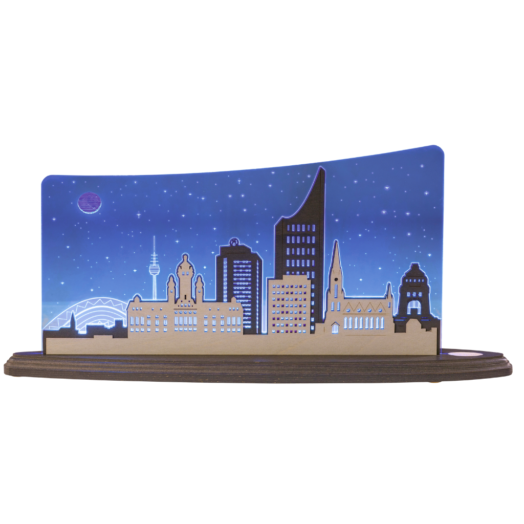 Dekoleuchte aus blauen Acrylglas in Verbindung mit grauen Sperrholz. Motiv ist die Stadt Leipzig. Hergestellt im Erzgebirge